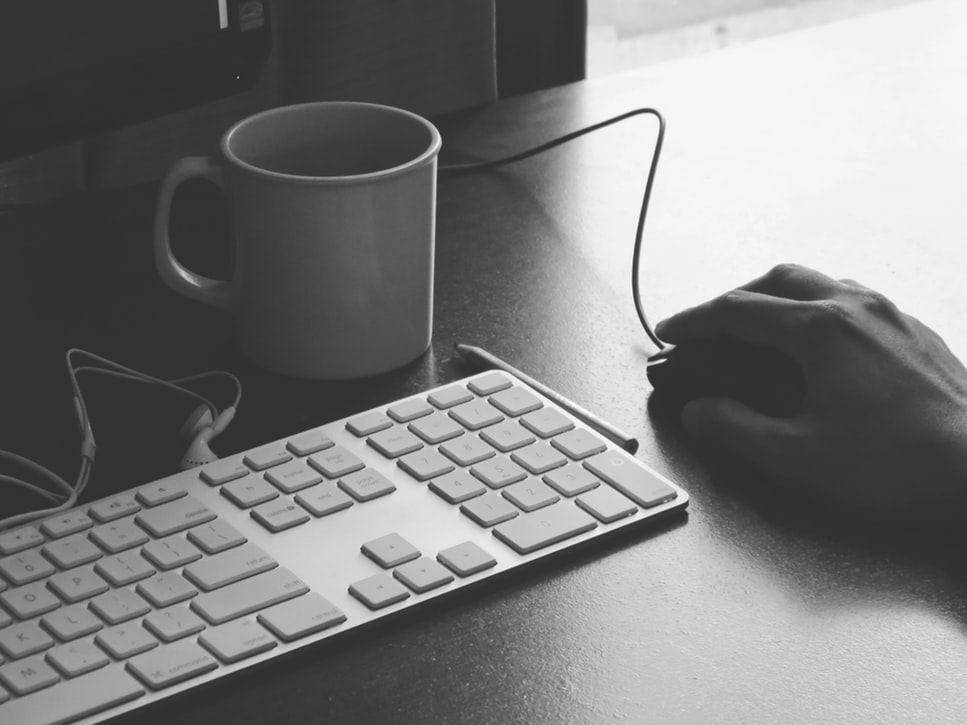 A keyboard and a mouse over a table